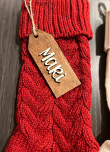 Load image into Gallery viewer, Red knitted scarf with a wooden tag labeled &#39;Maki&#39; on a dark background